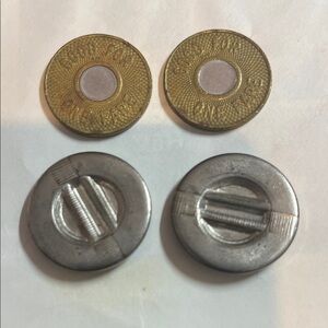 Two New York City Transit Authority tokens. Two Range Servant tokens